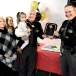 Capt. presents former Sheriff Al Kisner with plaque
